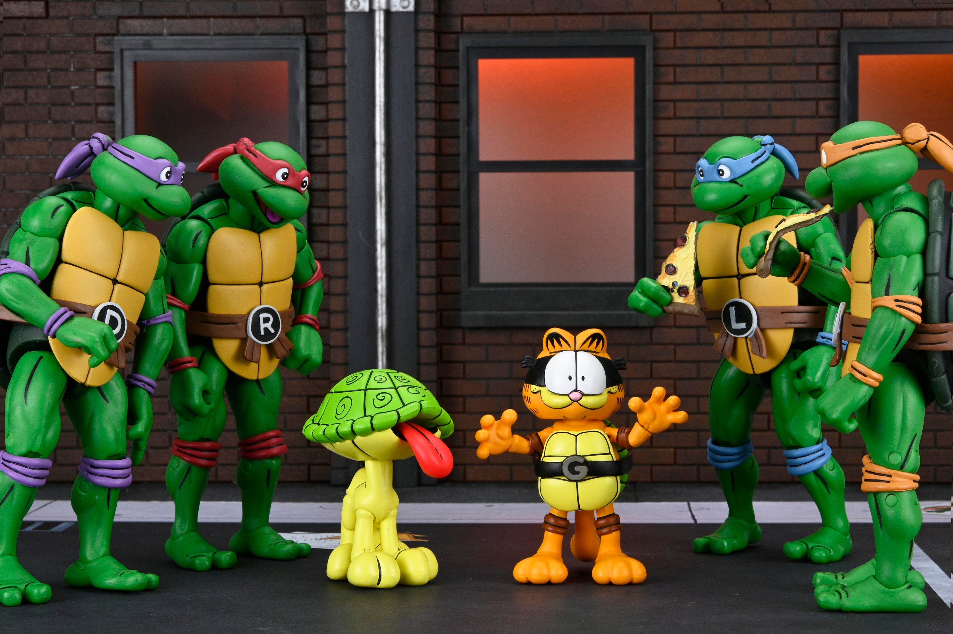 Teenage Mutant Ninja Turtles (Archie Comics) x Garfield - Ultimate Garfello & Odie 7” Scale Action Figures - NECA - Garfello and Odie shown with the four turtle brothers