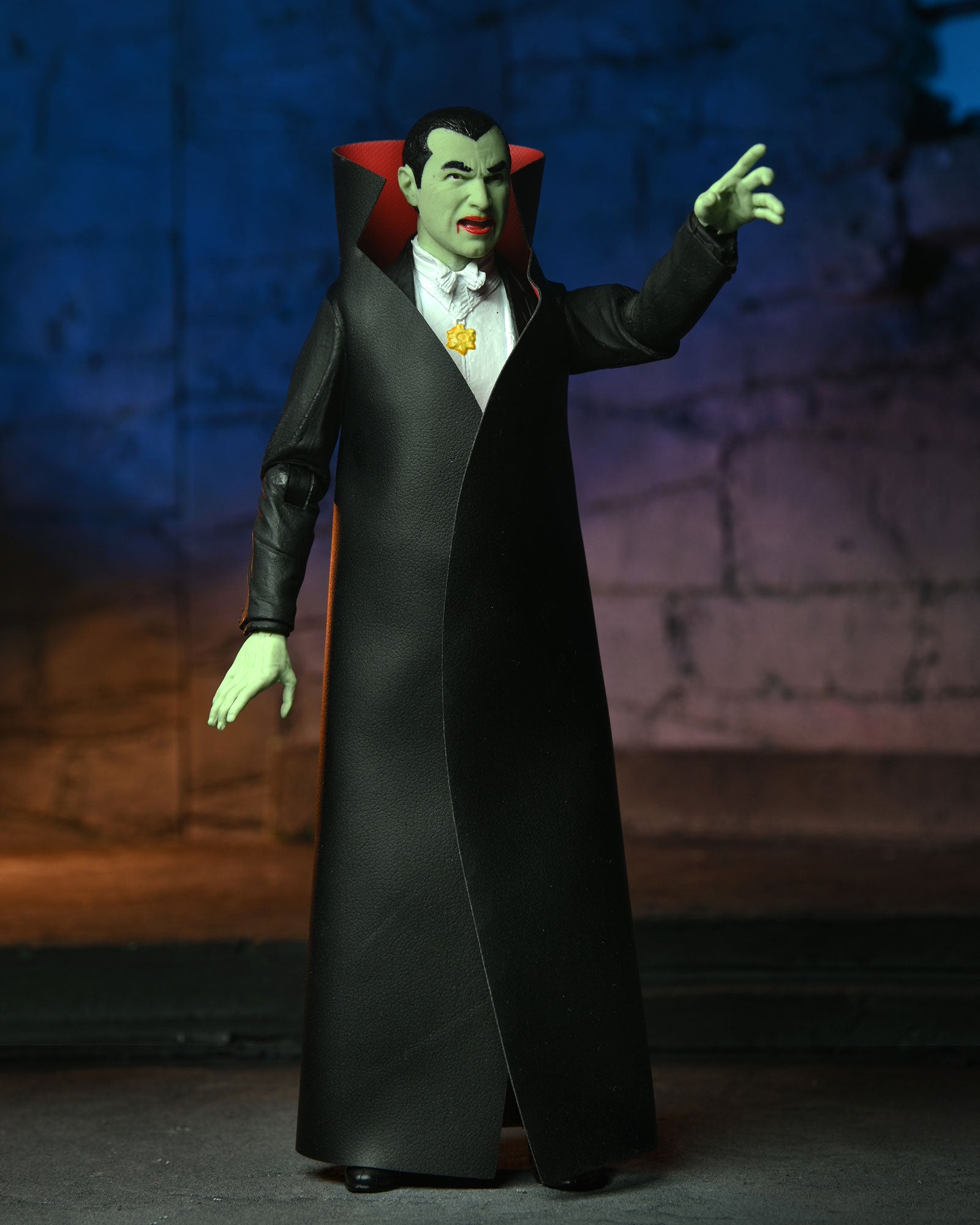 Universal Monsters - Glow-in-the-Dark Retro Dracula 7” Scale Action Figure pointing 