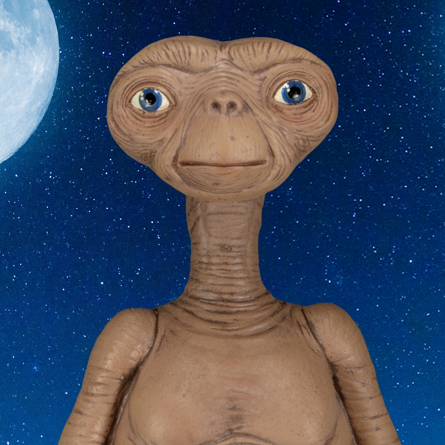 Close-up of E.T. Prop Replica 12” Foam Figure against a night sky